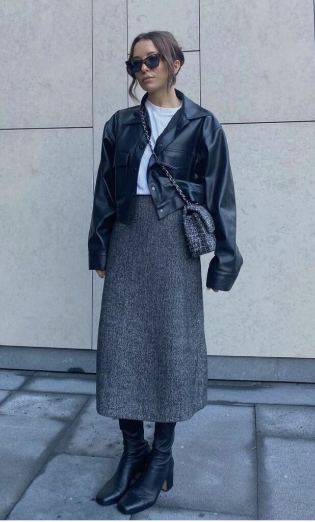 The-image-shows-a-lady-wearing-Leather -Biker- Jacket -with -a -Wool -Midi -Skirt