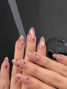 Nude-Nails-with-Red-Heart-Accents