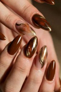 Bronze-Brown-Nails-with-Gold-Sculpted-Lines.