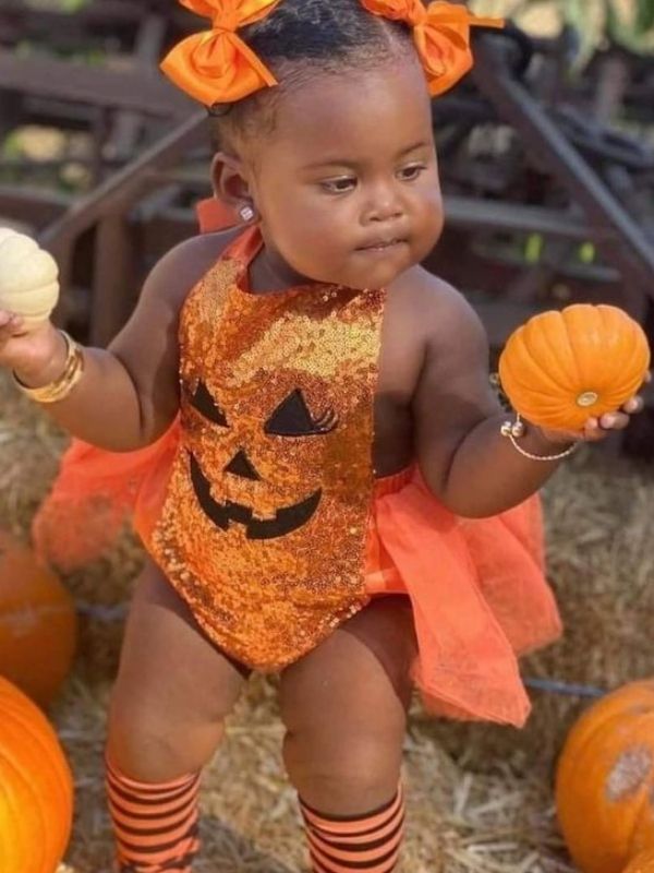 25-spooky-boss-baby-Halloween-costume-with-pumpkin. 