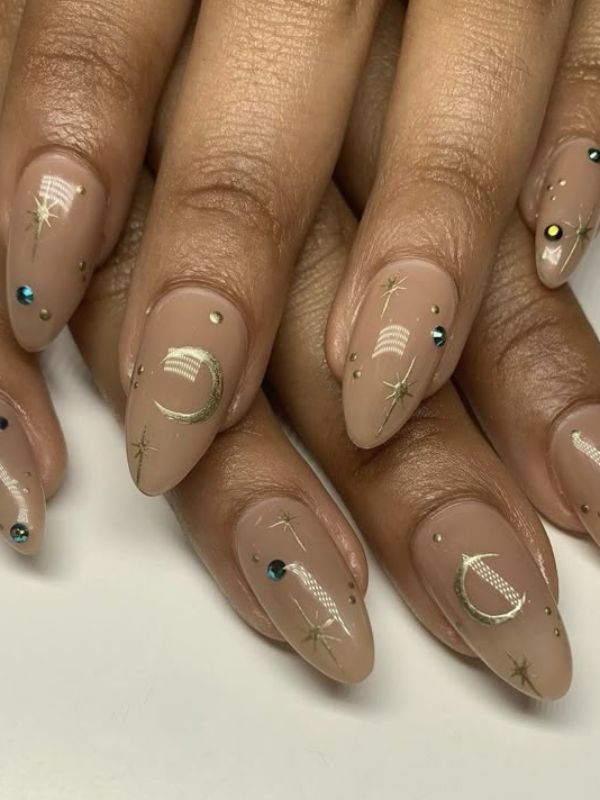 nude-nails-with-a-small-zodiac-sign.