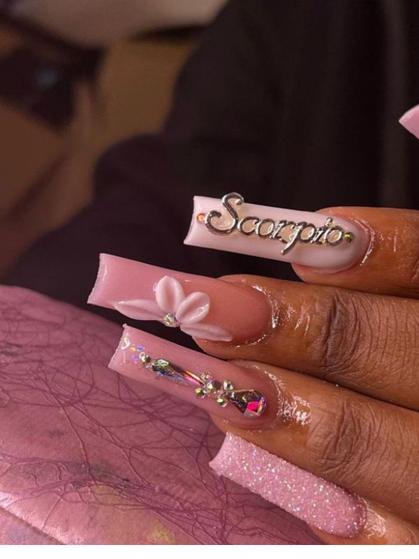 personalized-zodiac-manicure-with-stars-and-charm. 